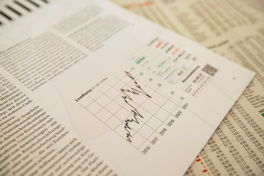 Trader analyzing economic data and fundamental indicators on computer screen for forex trading