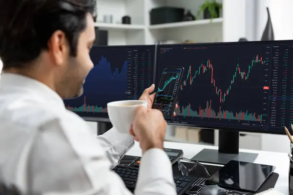 Trader businessman holding coffee cup